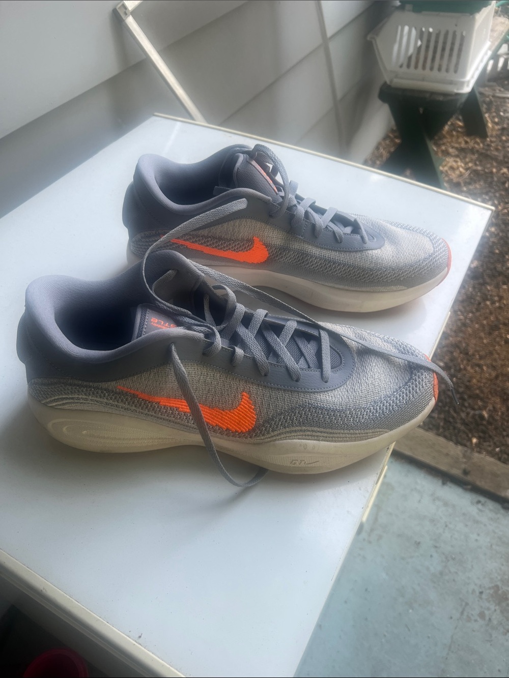 Nike Men’s Gray Sneakers with Bright Orange Swoosh